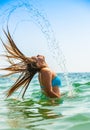 The attractive girl laying in sea Royalty Free Stock Photo