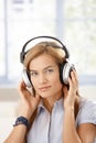 Attractive girl listening music through headphones Royalty Free Stock Photo