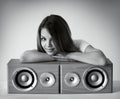 Attractive girl with loudspeakers Royalty Free Stock Photo