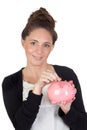 Attractive girl with money box insert coin Royalty Free Stock Photo