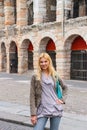 Attractive girl near the Arena of Verona in Italy