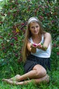 Attractive girl offering apples in hands Royalty Free Stock Photo