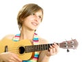 Attractive girl playing a Hawaiian guitar