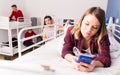 Girl ignoring neighbors in hostel