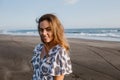 attractive girl standing in dress on beach in bali indonesia and looking Royalty Free Stock Photo