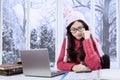 Attractive girl studying at winter time Royalty Free Stock Photo