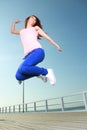 Attractive girl Young woman jumping sky Royalty Free Stock Photo