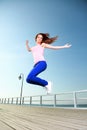 Attractive girl Young woman jumping sky Royalty Free Stock Photo