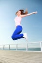 Attractive girl Young woman jumping sky Royalty Free Stock Photo