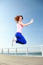 Attractive girl Young woman jumping sky Royalty Free Stock Photo