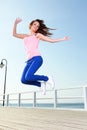 Attractive girl Young woman jumping sky Royalty Free Stock Photo