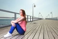 Attractive girl Young woman pier sea