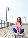 Attractive girl Young woman pier sea