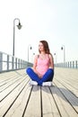 Attractive girl Young woman pier sea