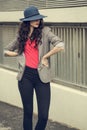 Attractive glamorous brunette wearing stylish clothes posing