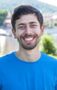 Attractive guy with beard and blue shirt is happy Royalty Free Stock Photo