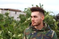 Attractive guy with military jacket Royalty Free Stock Photo