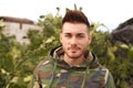 Attractive guy with military jacket Royalty Free Stock Photo