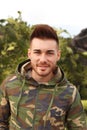 Attractive guy with military jacket Royalty Free Stock Photo