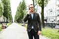 Attractive guy is talking phone on the street Royalty Free Stock Photo