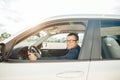 Handsome elegant serious man drives a car Royalty Free Stock Photo