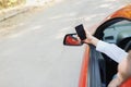 Attractive handsome elegant man in a business suit driving an expensive car. Royalty Free Stock Photo