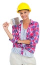 Attractive handy woman holding a brush and smiling at camera Royalty Free Stock Photo