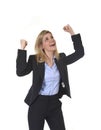 Attractive happy businesswoman posing gesturing with fist excited in business success Royalty Free Stock Photo