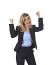 Attractive happy businesswoman posing gesturing with fist excited in business success Royalty Free Stock Photo