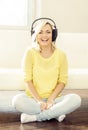Attractive happy girl listening music at home Royalty Free Stock Photo