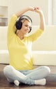 Attractive happy girl listening music at home. Royalty Free Stock Photo