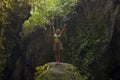 Attractive and happy mid adult woman with grey hair 40s or 50s enjoying blissful and free at beautiful green tropical forest Royalty Free Stock Photo