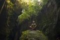 Attractive and happy mid adult woman with grey hair 40s or 50s enjoying blissful and free sitting in lotus yoga pose at beautiful Royalty Free Stock Photo