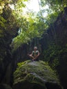 Attractive and happy mid adult woman with grey hair 40s or 50s enjoying blissful and free sitting in lotus yoga pose at beautiful Royalty Free Stock Photo