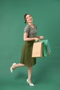 Attractive happy smiling stylish woman holding colorful shopping bags Royalty Free Stock Photo