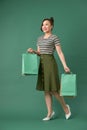 Attractive happy smiling stylish woman holding colorful shopping bags Royalty Free Stock Photo