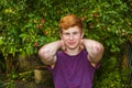 Attractive happy smiling teen boy in the garden Royalty Free Stock Photo