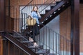 Attractive happy young asian woman going shopping walking down t Royalty Free Stock Photo