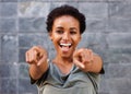 Attractive happy young black woman pointing fingers Royalty Free Stock Photo