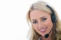 Attractive Happy Young Business Woman Using a Telephone Headset Royalty Free Stock Photo