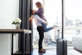 Attractive happy young couple in love having fun and hugging in hotel room Royalty Free Stock Photo