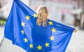 Attractive happy young girl with the flag of the European Union