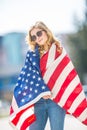 Attractive happy young girl with the flag of the United states of America Royalty Free Stock Photo
