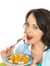 Attractive Happy Young Hispanic Woman Eating a Plate of Seafood Linguine Royalty Free Stock Photo