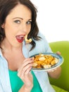 Attractive Happy Young Hispanic Woman Eating a Plate of Seafood Linguine Royalty Free Stock Photo