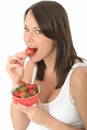 Attractive Healthy Happy Natural Young Woman Eating a Bowl of Fresh Ripe Juicy Strawberries Royalty Free Stock Photo