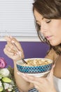 Attractive Healthy Young Woman Eating Breakfast Cereal Royalty Free Stock Photo