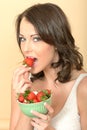 Attractive Healthy Young Woman Eating Fresh Strawberries Royalty Free Stock Photo