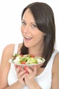 Attractive Healthy Young Woman Holding a Plate of Fresh Chicken Salad Royalty Free Stock Photo