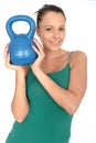 Attractive Healthy Young Woman Lifting a 5kg Kettle Bell Weight Royalty Free Stock Photo